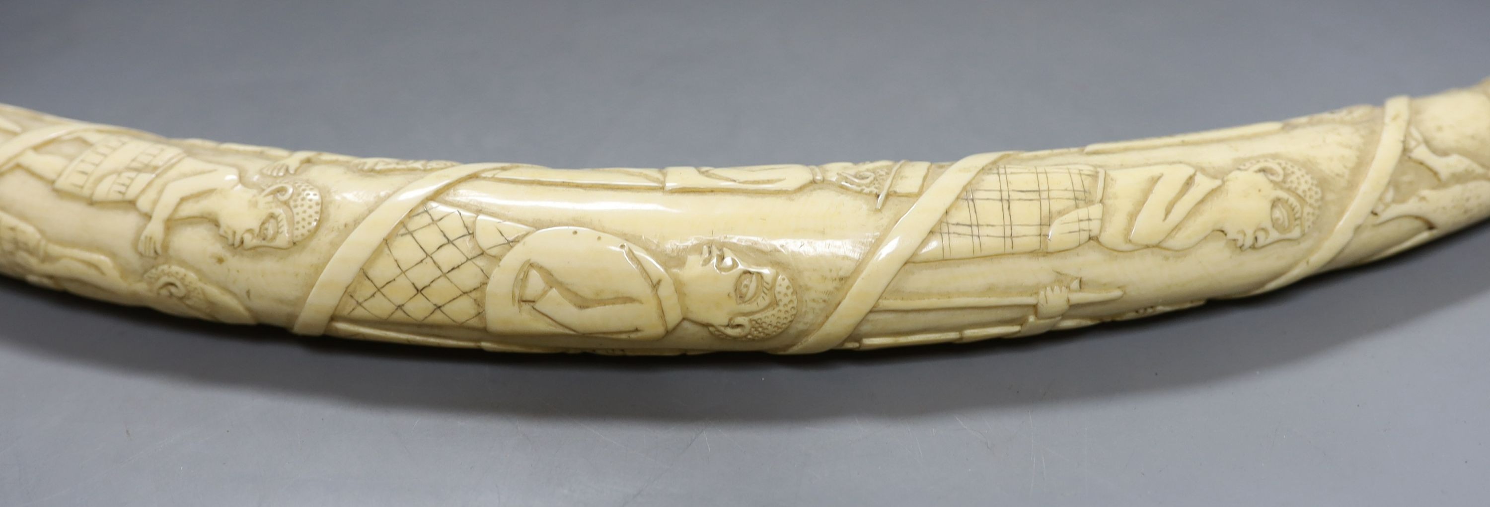 A 19th-century Luango tribal carved ivory tusk, Democratic Republic of Congo, 53 cm long